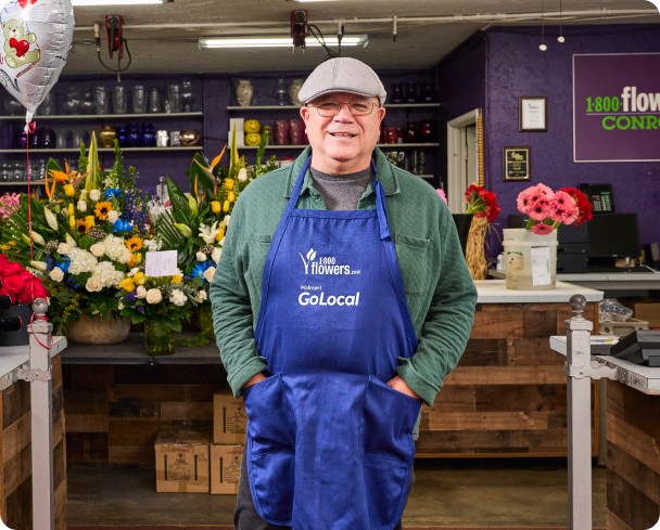 Desk at retail lounge with the retail lounge logo display on the back wall