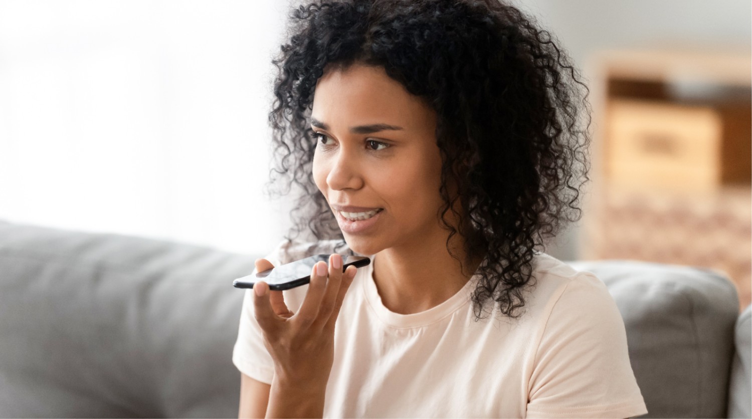 A woman using Walmart's conversational platform with a voice interface.