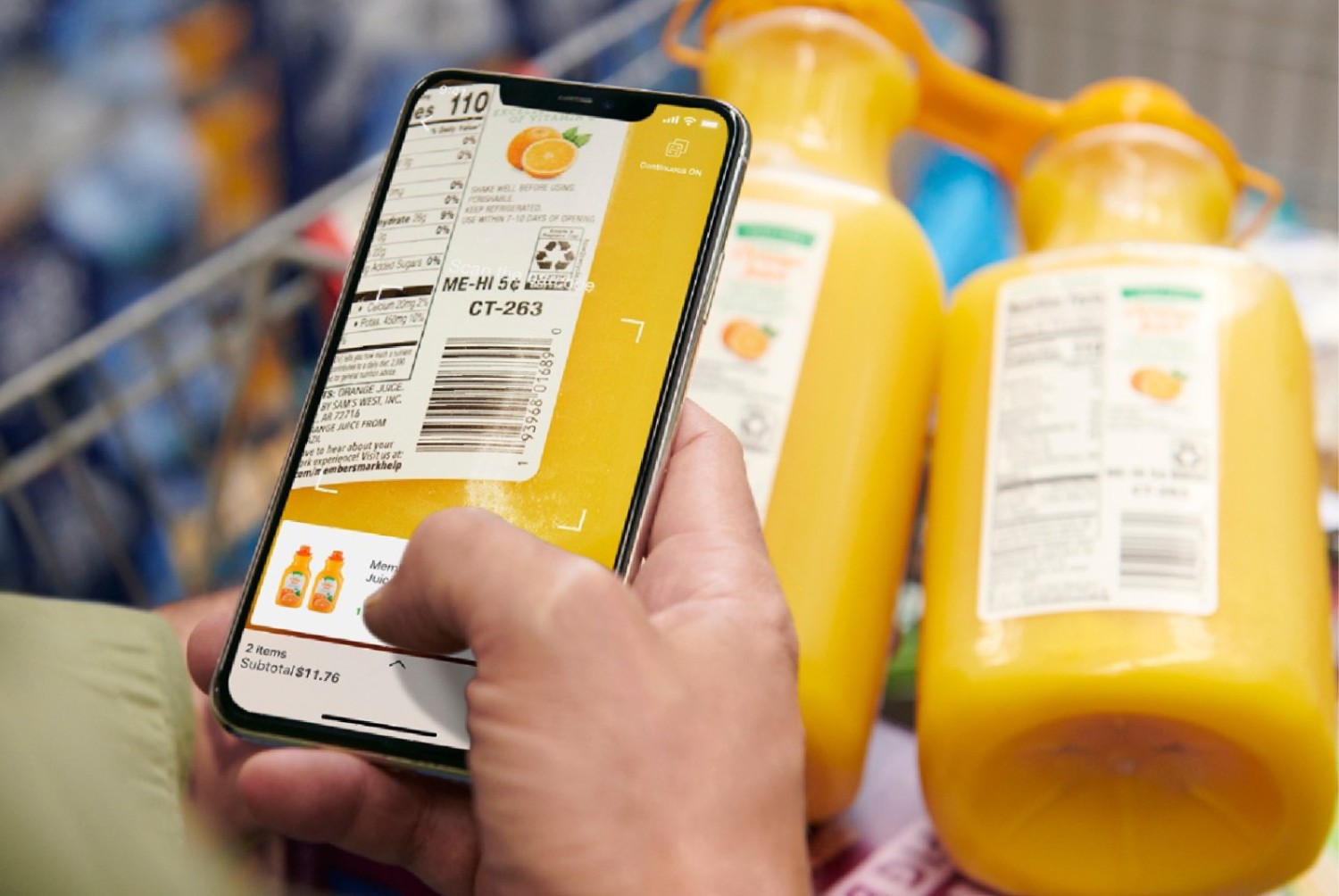 A customer scanning the barcode of a product with their phone.