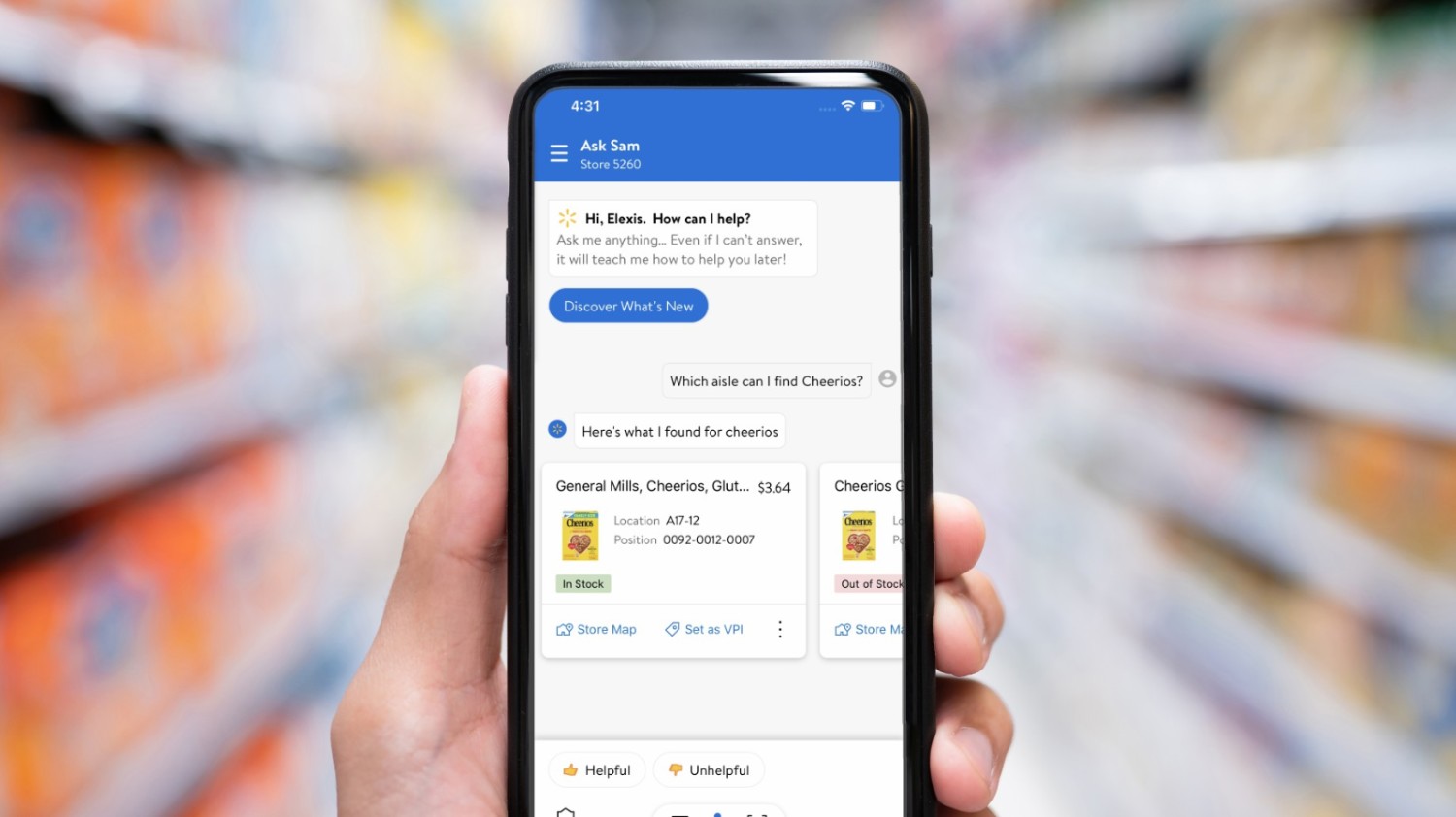 An associate is holding a phone, interacting with Ask Sam, Walmart’s voice assistant for in-store associates.